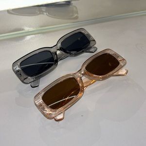 2 Clearish sunglasses, black/brown